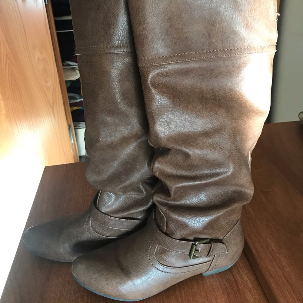 Brown knee high belted boots